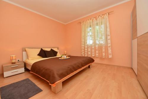 Posteľ alebo postele v izbe v ubytovaní Apartment Kokic