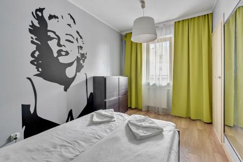 Postelja oz. postelje v sobi nastanitve Grand Apartments - Davos Apartment Gdańsk Szafarnia River View