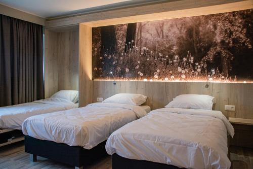 Säng eller sängar i ett rum på De Zwaluwhoeve