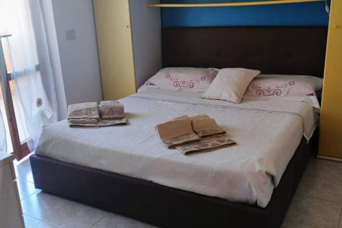 Ліжко або ліжка в номері Appartamento Tre Angeli a pochi passi dal mare