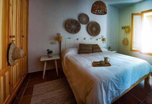Posteľ alebo postele v izbe v ubytovaní La casa de la abuela Regina
