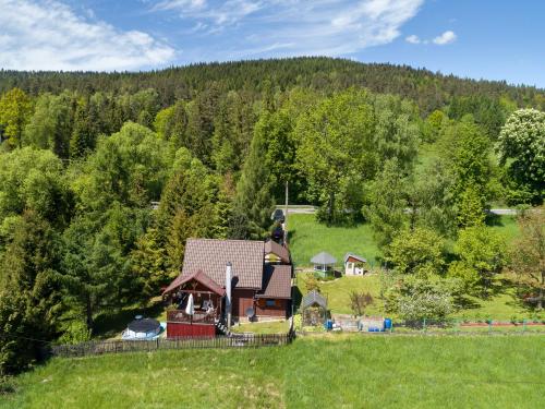 an aerial view of a house in the middle of a field at Andrzejówka in Kocoń