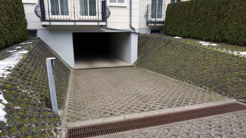 a building with a tunnel in front of it at Appartements Haus Tannenburg in Ahlbeck