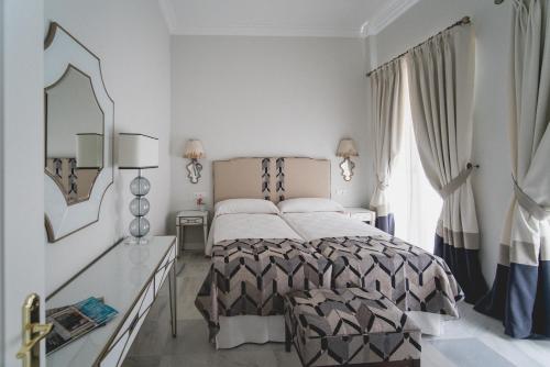 Postel nebo postele na pokoji v ubytování Apartamentos Abreu Suites