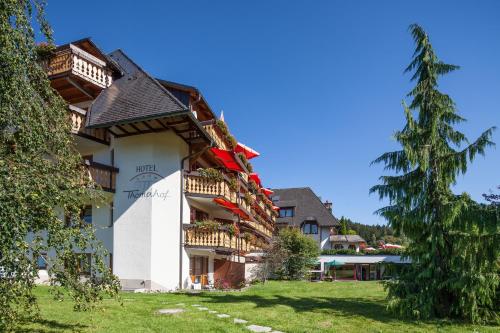 a building with balconies on the side of it at Hotel Thomahof in Hinterzarten