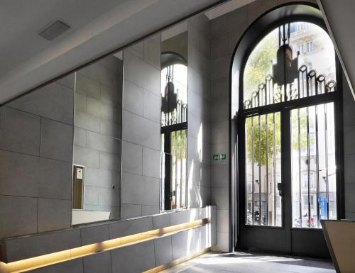 an entrance to a building with a large window at Numa Madrid Script in Madrid