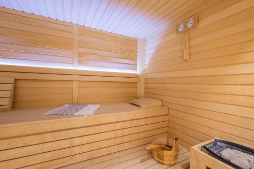 a wooden sauna with a bed in the middle at Villa Grandioza in Seline