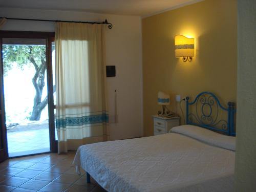 Un ou plusieurs lits dans un hébergement de l'établissement Hotel Valkarana Country Relais