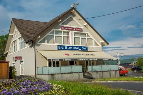 a building with a sign that reads exanimal at Apartments and Rooms Millennium in Ogulin