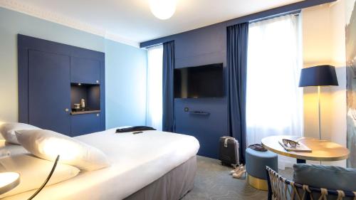 Mercure Marseille Centre Bompard La Cornicheにあるテレビまたはエンターテインメントセンター