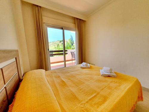 En eller flere senge i et værelse på Casa Laarne