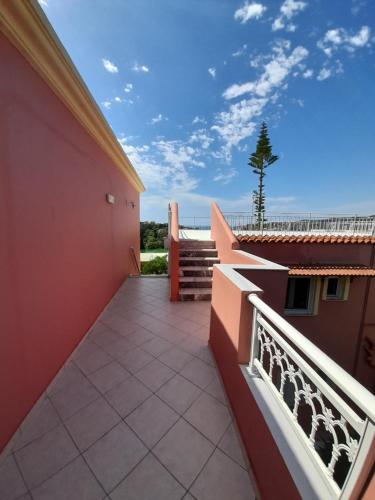 a balcony of a house with a view of the ocean at Angelos aparts in Arillas