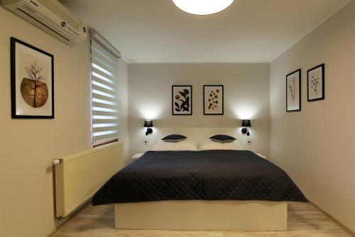a bedroom with a bed in a room at Penzion U Vlků in Valtice