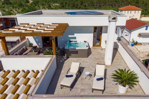 a view of a house with a swimming pool at Villa Grandioza in Seline