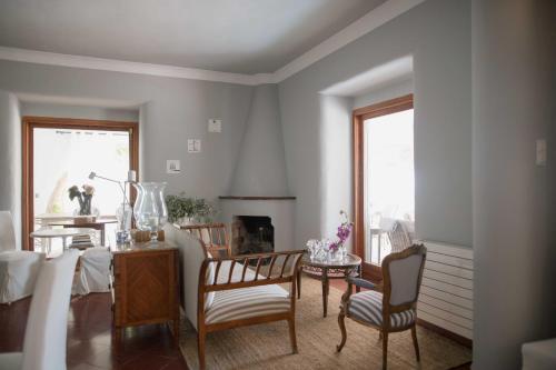 a living room with a dining room table and chairs at Villa Dora (Only adults) in Jávea