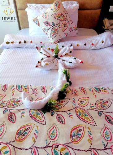 two swans on top of a bed at Jewel Matrouh Hotel in Marsa Matruh