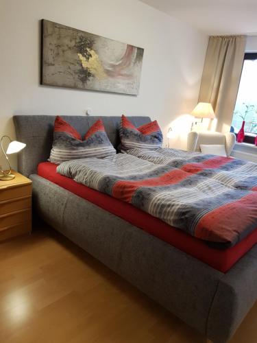 מיטה או מיטות בחדר ב-Appartementresidenz am Kurpark Bad Salzuflen