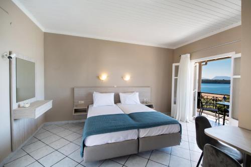 Ένα ή περισσότερα κρεβάτια σε δωμάτιο στο Spiros Sea View