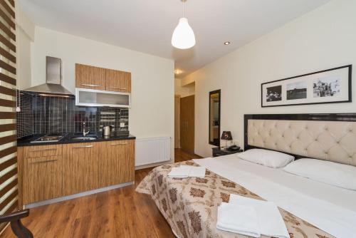 Postel nebo postele na pokoji v ubytování Invictum Residence