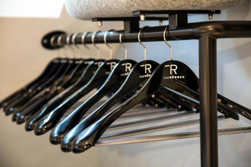 a bunch of utensils hanging on a rack at The Roebbek x Hanse in Hamburg