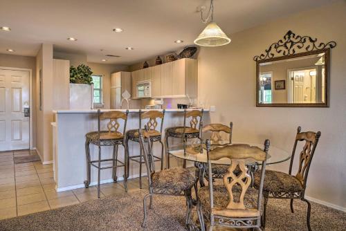a kitchen with a table and chairs and a bar at Champions Retreat Condo Near 76 Strip in Branson