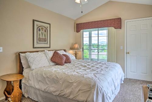 a bedroom with a large bed and a window at Champions Retreat Condo Near 76 Strip in Branson