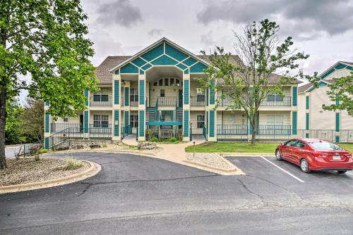 a red car parked in front of a house at Champions Retreat Condo Near 76 Strip in Branson
