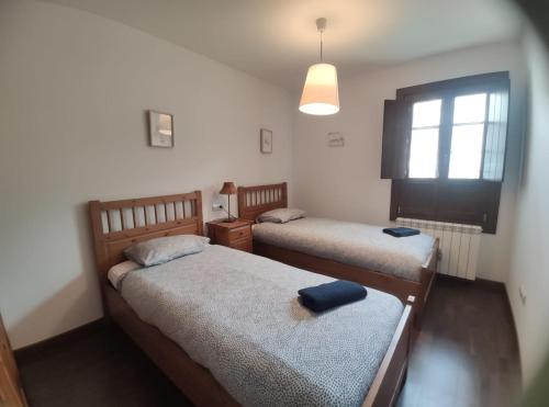 Postel nebo postele na pokoji v ubytování Mirador de Leres