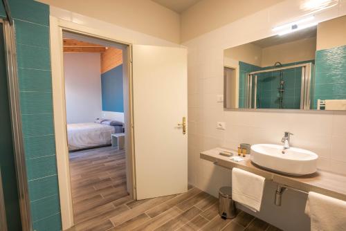 Ett badrum på Hotel Cavallo Bianco