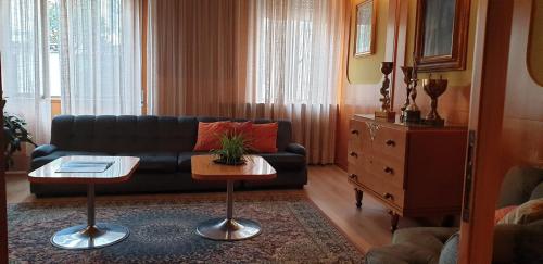 a living room with a couch and a table at Ristorante Albergo Roma in Legnano