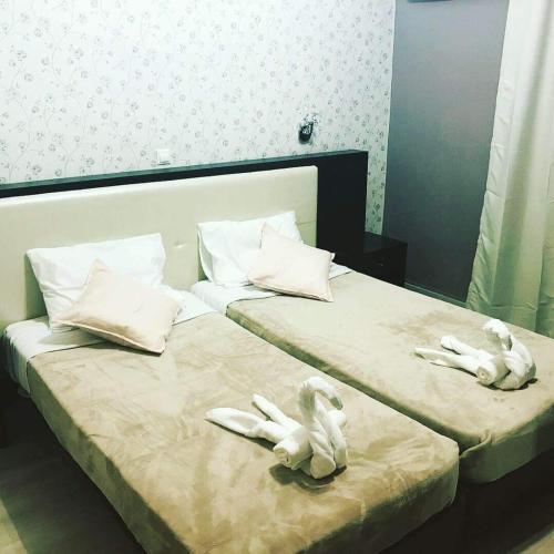 Ένα ή περισσότερα κρεβάτια σε δωμάτιο στο Aegean Sea Rooms