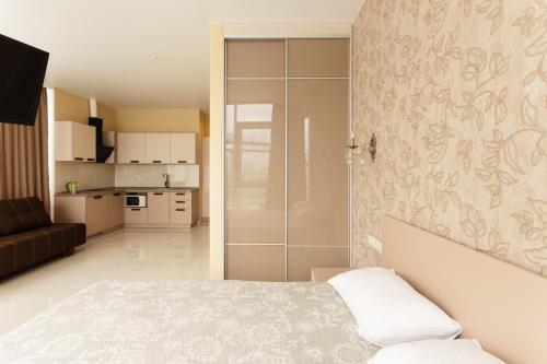 Ένα ή περισσότερα κρεβάτια σε δωμάτιο στο Arcadia Panoramic View Luxury Apartments