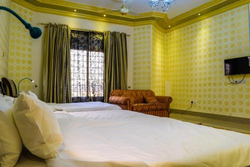 Ein Bett oder Betten in einem Zimmer der Unterkunft Arabian Lodges
