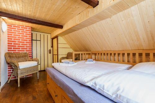 Postel nebo postele na pokoji v ubytování Chata Nerudovka