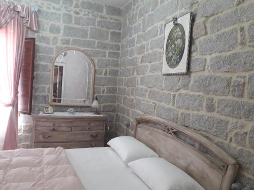 Tempat tidur dalam kamar di Casa Mene'