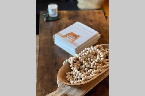 a bowl of chickpeas and a book on a table at Mary-Jane’s Cottage in Omagh