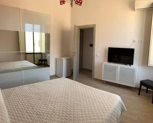 Postel nebo postele na pokoji v ubytování La Terrazza su Trapani - Alloggio Roma