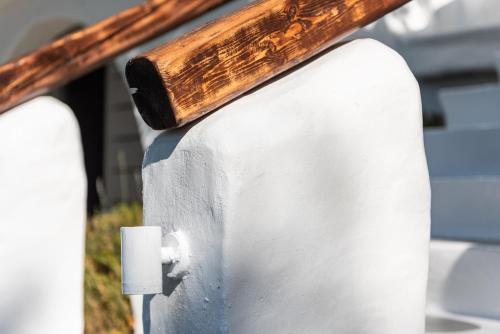 a piece of wood on top of a white wall at Casa Montzo boutique hotel in Katelios