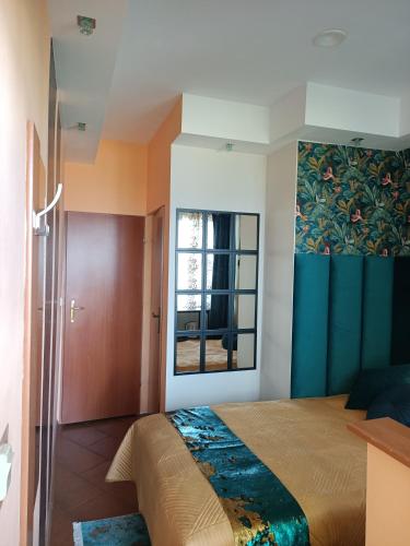 Postel nebo postele na pokoji v ubytování Vanilla Pokoje i Apartamenty Nad Brzegiem Jeziora