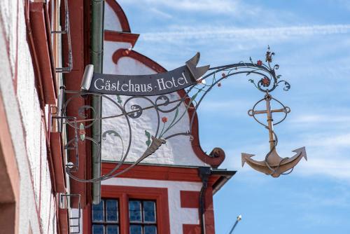 a street sign on the side of a building at Hotel Centgraf in Buergstadt