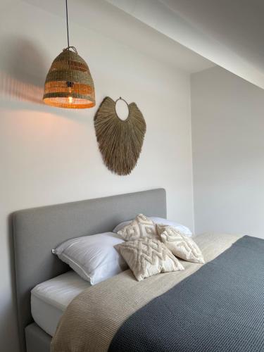 Een bed of bedden in een kamer bij Dune Du Clémot