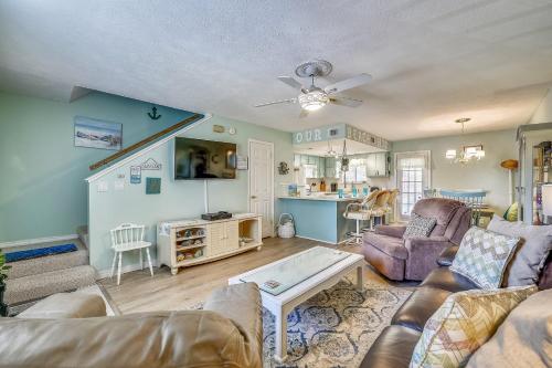 a living room with a couch and a table at 5 O'Clock Somewhere by Book That Condo in Panama City Beach