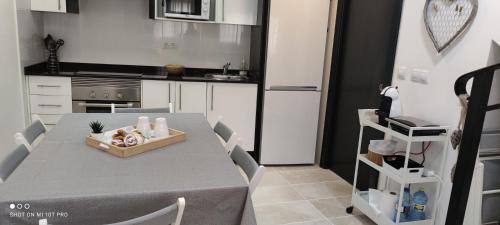 a kitchen with a table and chairs and a kitchen with a tableablish at El Enclave in Chulilla