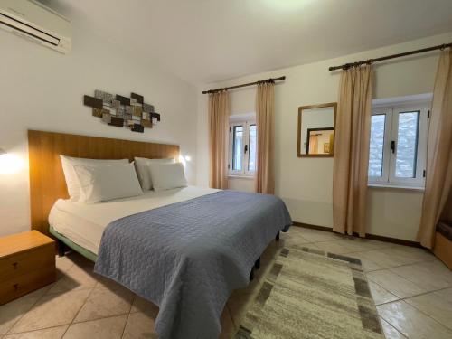 Ένα ή περισσότερα κρεβάτια σε δωμάτιο στο Rooms and Apartments Villa Town Gate Hvar