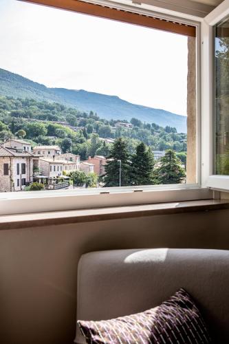 a large window with a view of a city at Hotel Porta Nuova in Assisi