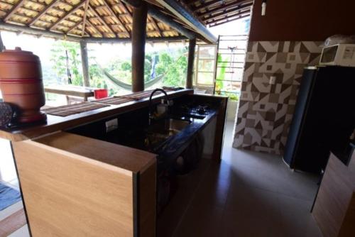 A cozinha ou cozinha compacta de Suítes Alto Itamambuca