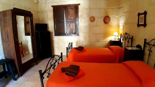 Postel nebo postele na pokoji v ubytování B&B La Nicchiarica