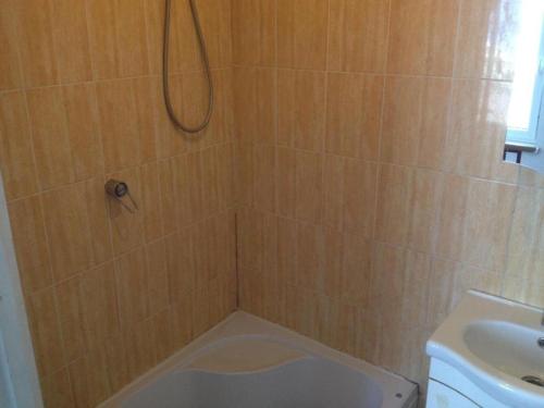 a bathroom with a shower with a toilet and a sink at Pirtis Prie Neries Jonava in Jonava