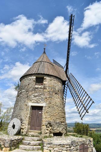 a stone windmill with a cross on top of it at ibis Styles Castelnaudary in Castelnaudary