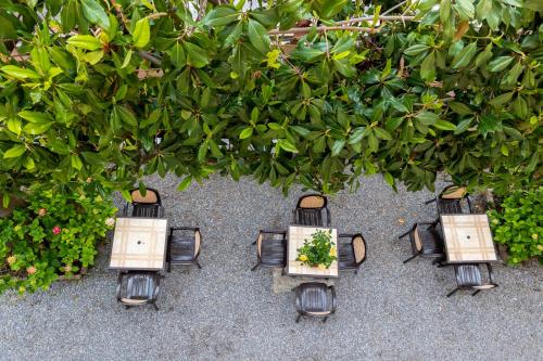 a group of four lights with a plant in them at Villa Adriana in Pietra Ligure